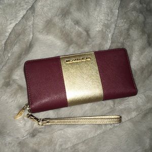 Michael Kors center stripe wallet Merlot wristlet